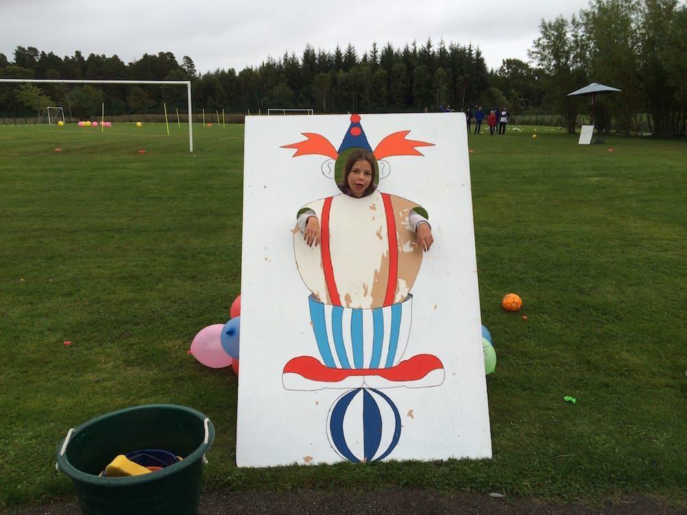 Ms.10 makes a silly face at the start of the Culbokie Primary school fair