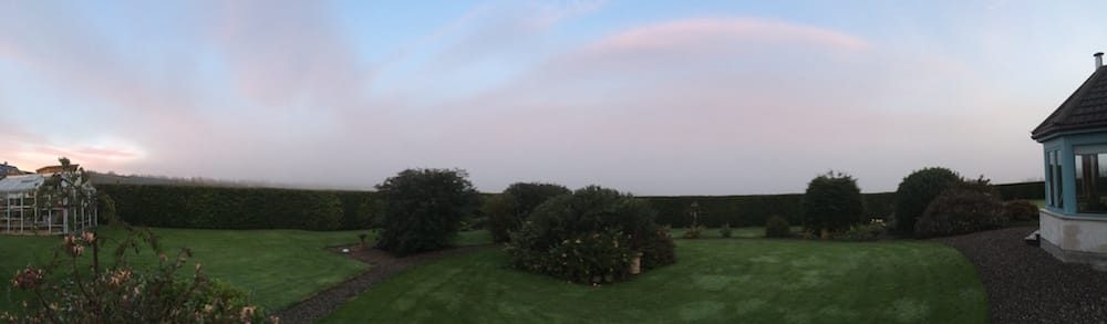 Panorama view of a sunrise at our housesit house