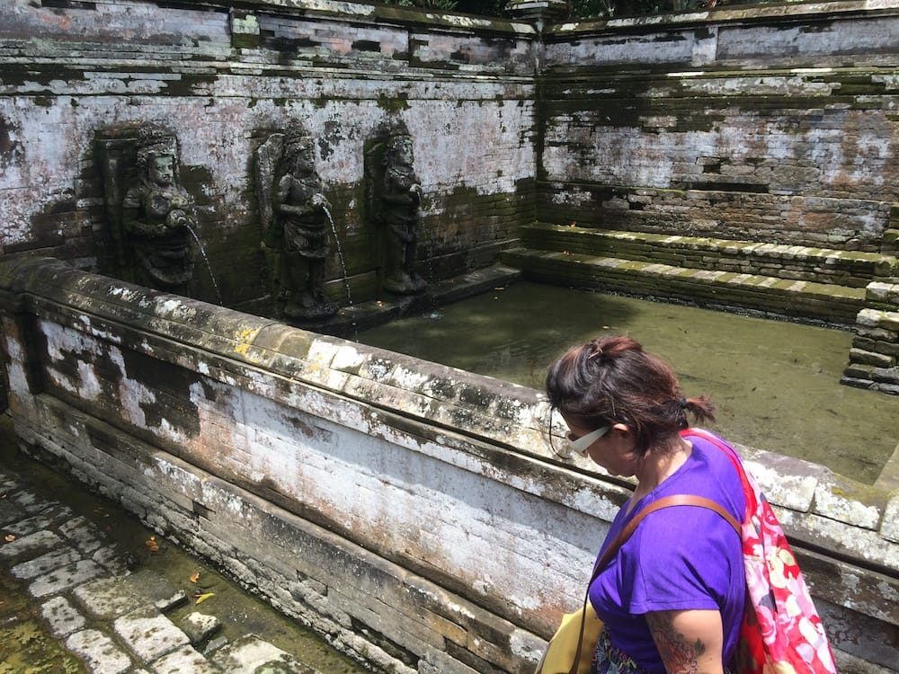 The sacred pools at Goa Gajah, we're down the stairs and at pool level